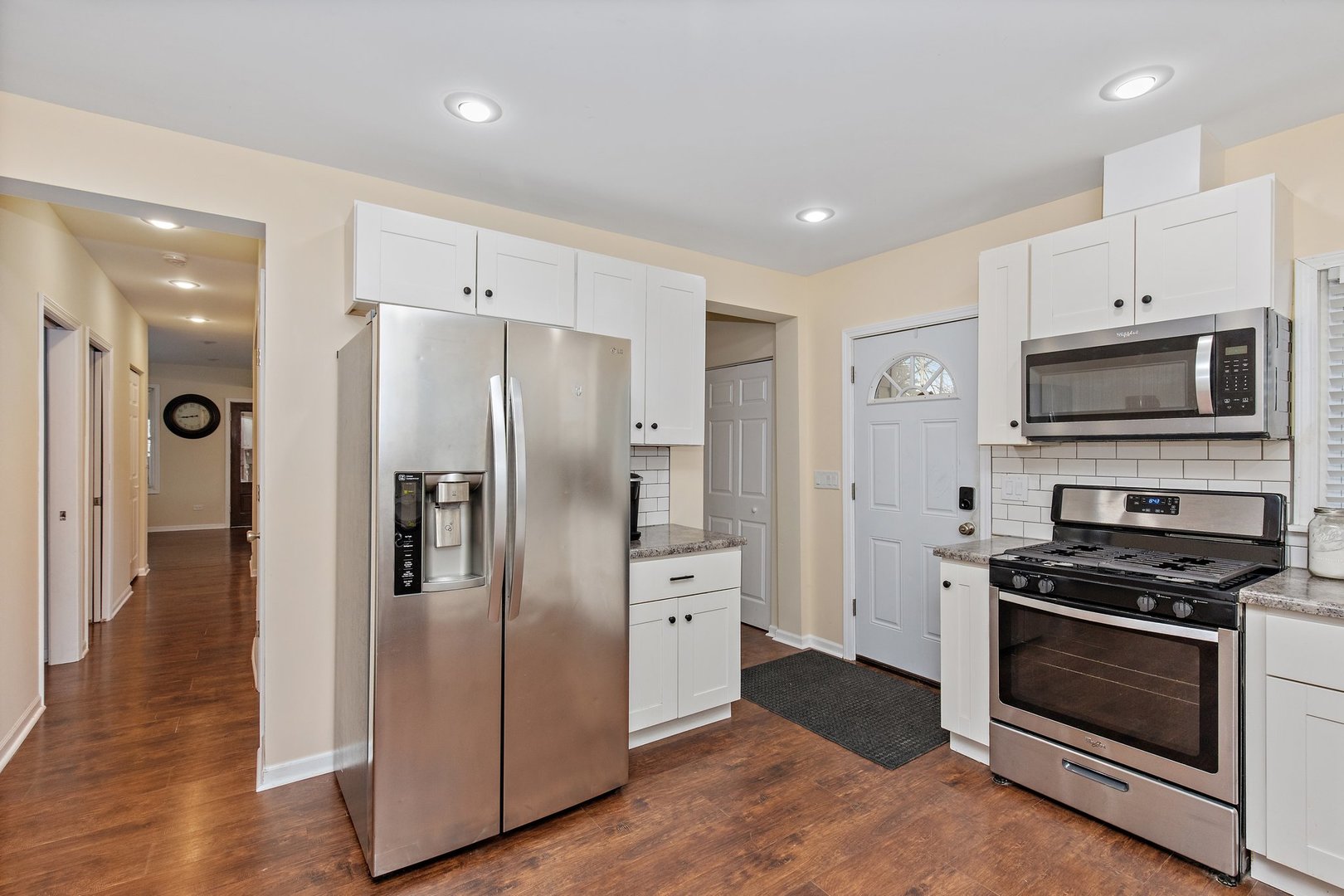 162 Park Street Hampshire, IL 60140 - Photo 10 of 25 a kitchen with stainless steel appliances a refrigerator stove and microwave