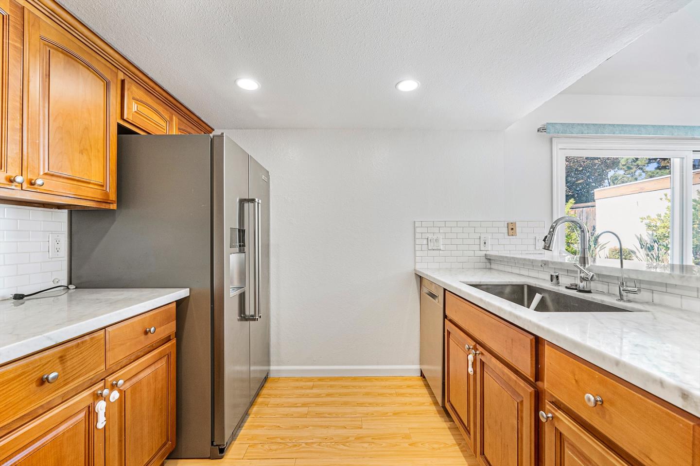 3691 Dryden Road Fremont, CA 94555 - Photo 11 of 26 a kitchen with a sink stove and cabinets