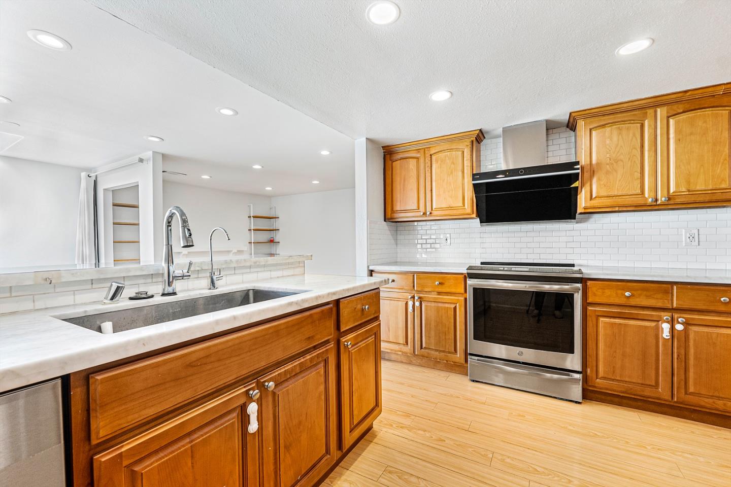 3691 Dryden Road Fremont, CA 94555 - Photo 12 of 26 a kitchen with stainless steel appliances granite countertop a sink stove and microwave