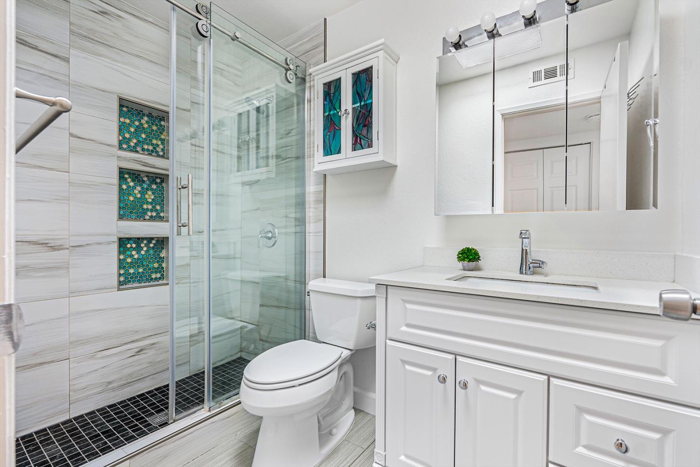 3691 Dryden Road Fremont, CA 94555 - Photo 17 of 26 a bathroom with a sink a toilet and shower
