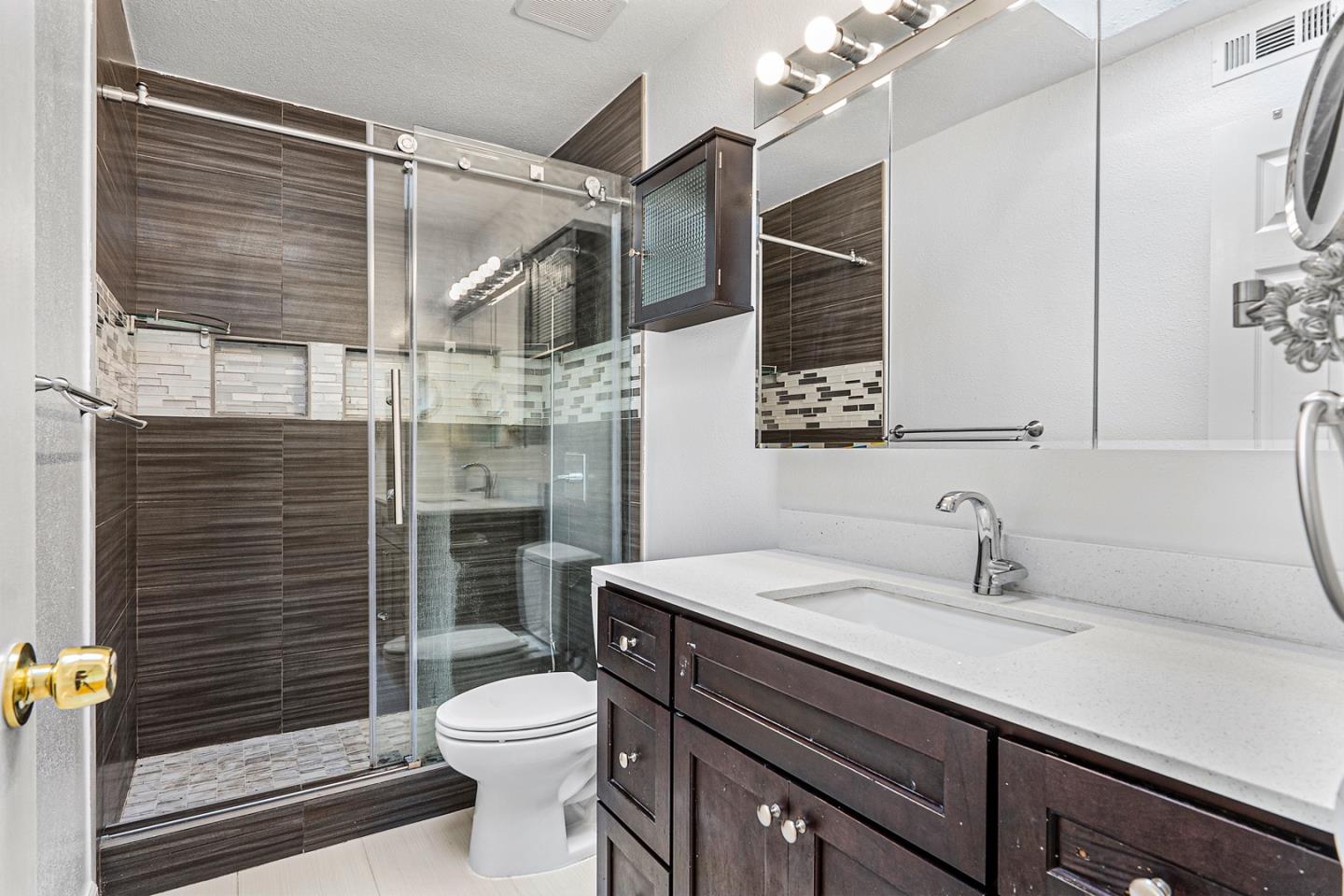 3691 Dryden Road Fremont, CA 94555 - Photo 22 of 26 a bathroom with a sink a toilet and shower