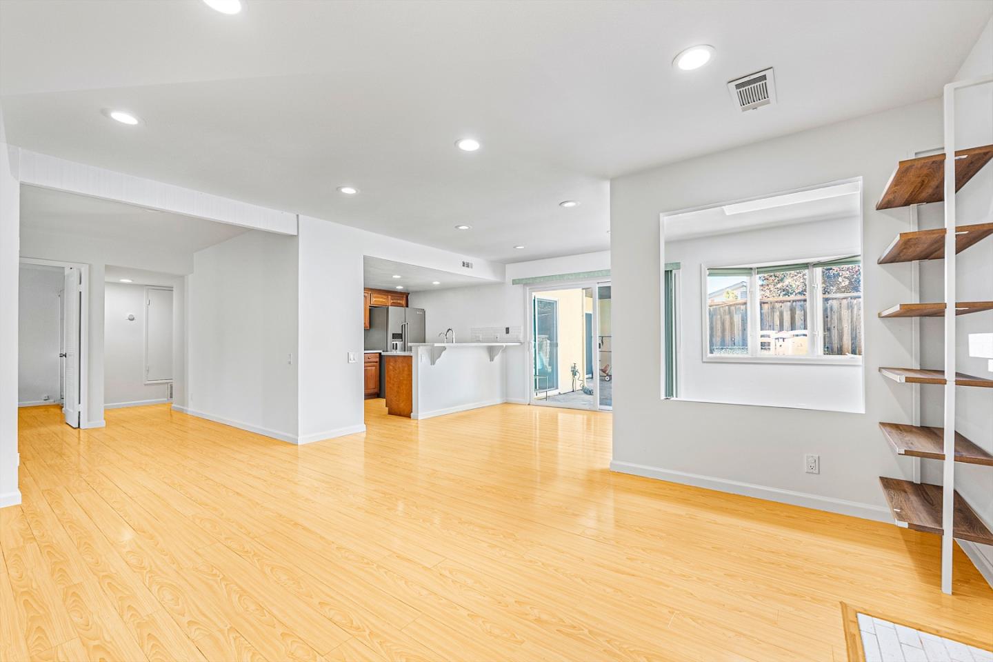 3691 Dryden Road Fremont, CA 94555 - Photo 4 of 26 a view of an empty room with window and a kitchen