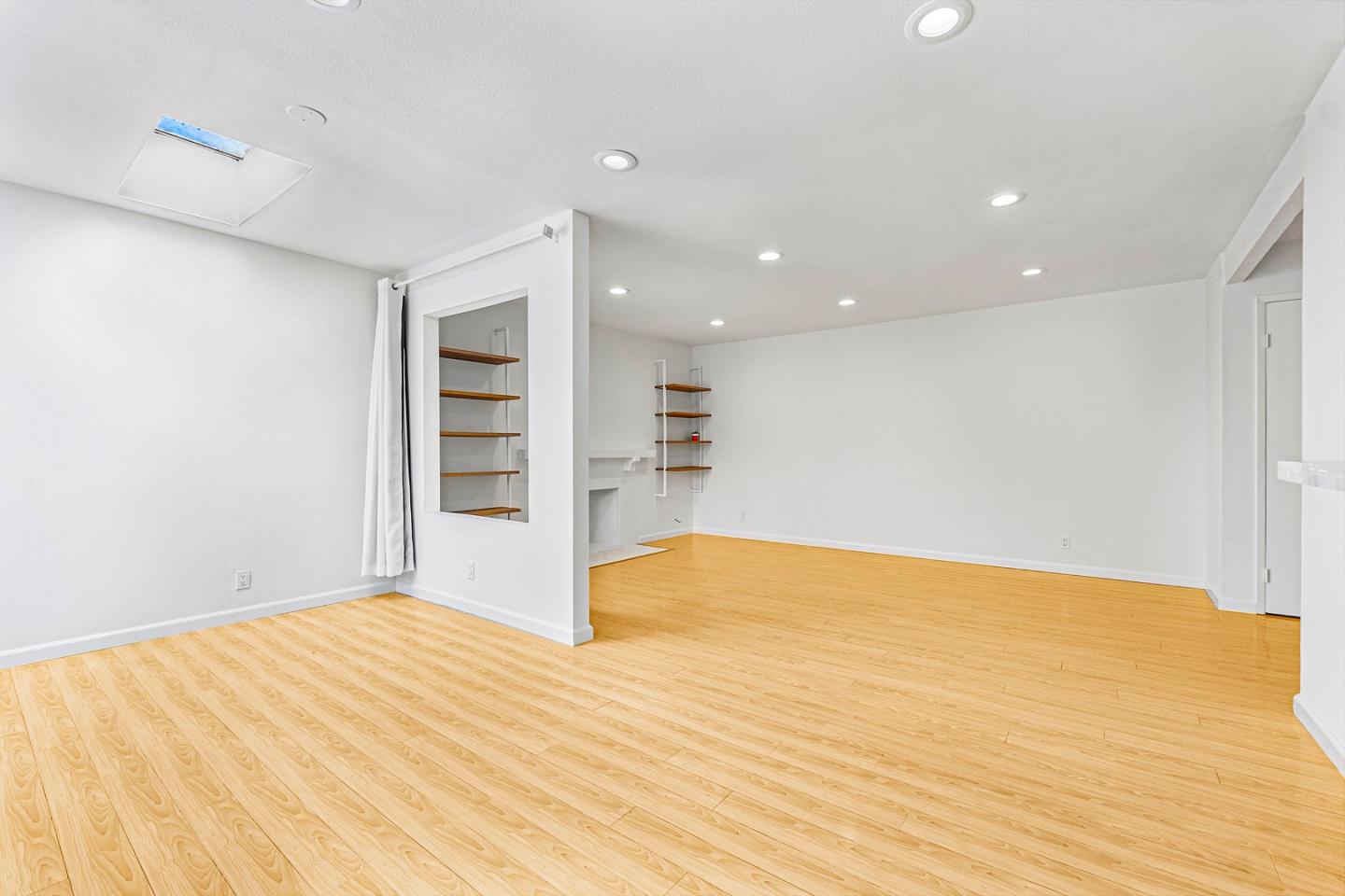 3691 Dryden Road Fremont, CA 94555 - Photo 6 of 26 a view of an empty room with wooden floor and a window