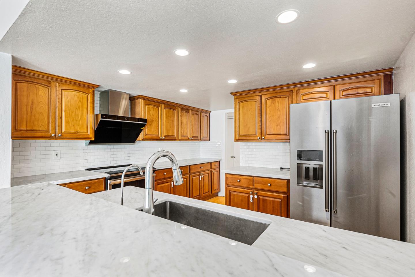 3691 Dryden Road Fremont, CA 94555 - Photo 8 of 26 a kitchen with granite countertop a sink stainless steel appliances and counter space