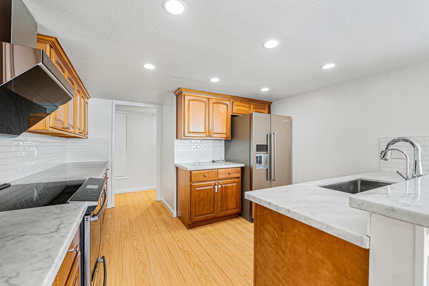 3691 Dryden Road Fremont, CA 94555 - Photo 9 of 26 a kitchen with stainless steel appliances granite countertop a sink a stove and a refrigerator