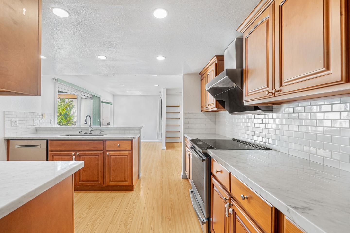 3691 Dryden Road Fremont, CA 94555 - Photo 10 of 26 a kitchen with stainless steel appliances granite countertop a sink and a stove