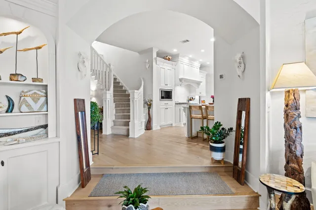 a view of a balcony with furniture and a potted plant