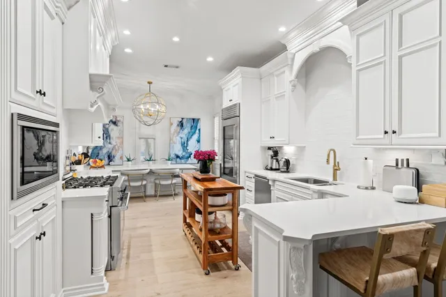 a front view of a house with a garden and deck