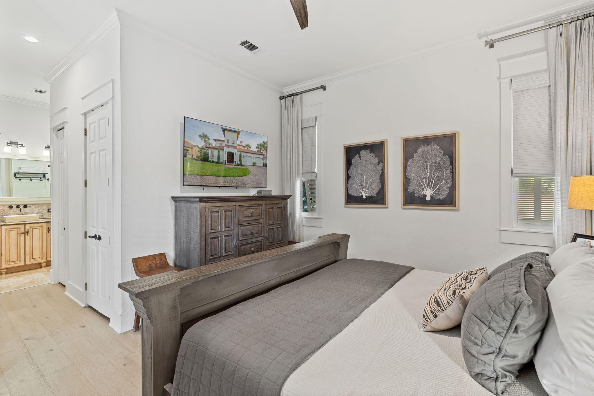 1821 Baytowne Avenue Miramar Beach, FL 32550 - Photo 20 of 63 a bedroom with a bed and a painting on the wall