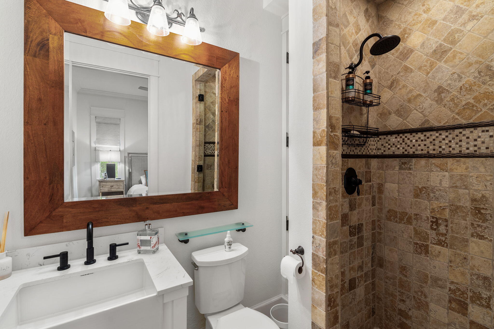 1821 Baytowne Avenue Miramar Beach, FL 32550 - Photo 24 of 63 a bathroom with a shower a sink and a mirror