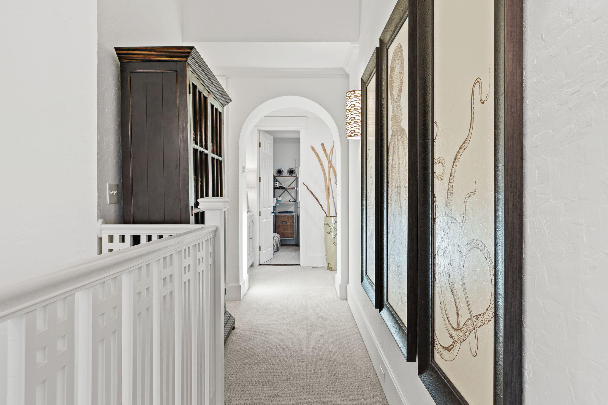1821 Baytowne Avenue Miramar Beach, FL 32550 - Photo 29 of 63 a view of a hallway with wooden floor and cabinet