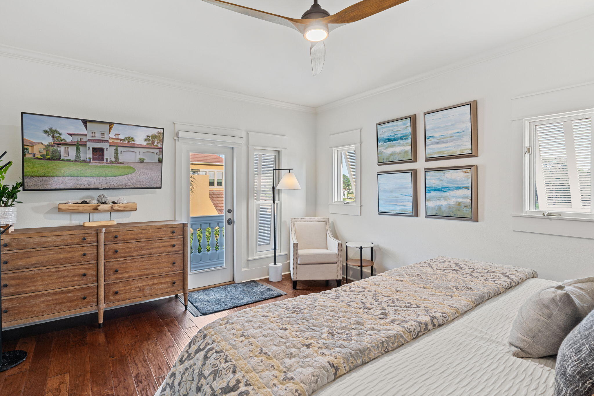 1821 Baytowne Avenue Miramar Beach, FL 32550 - Photo 35 of 63 a bedroom with a bed and wooden floor