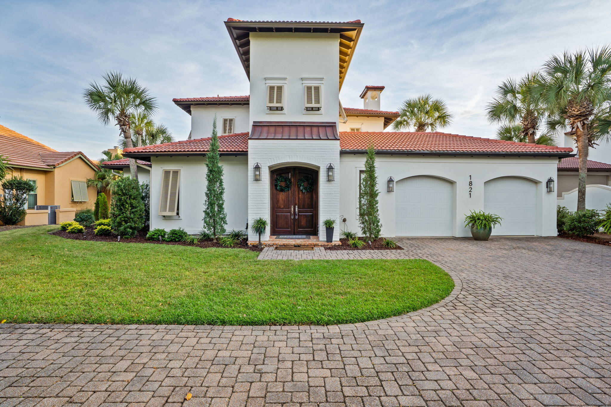 1821 Baytowne Avenue Miramar Beach, FL 32550 - Photo 4 of 63 a front view of a house with garden