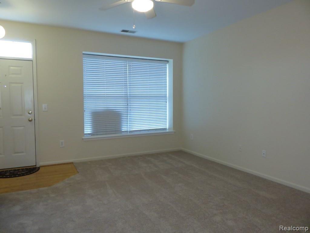 1104 Rial Lake Drive Howell, MI 48843 - Photo 13 of 31 New carpet and fresh paint in open great room