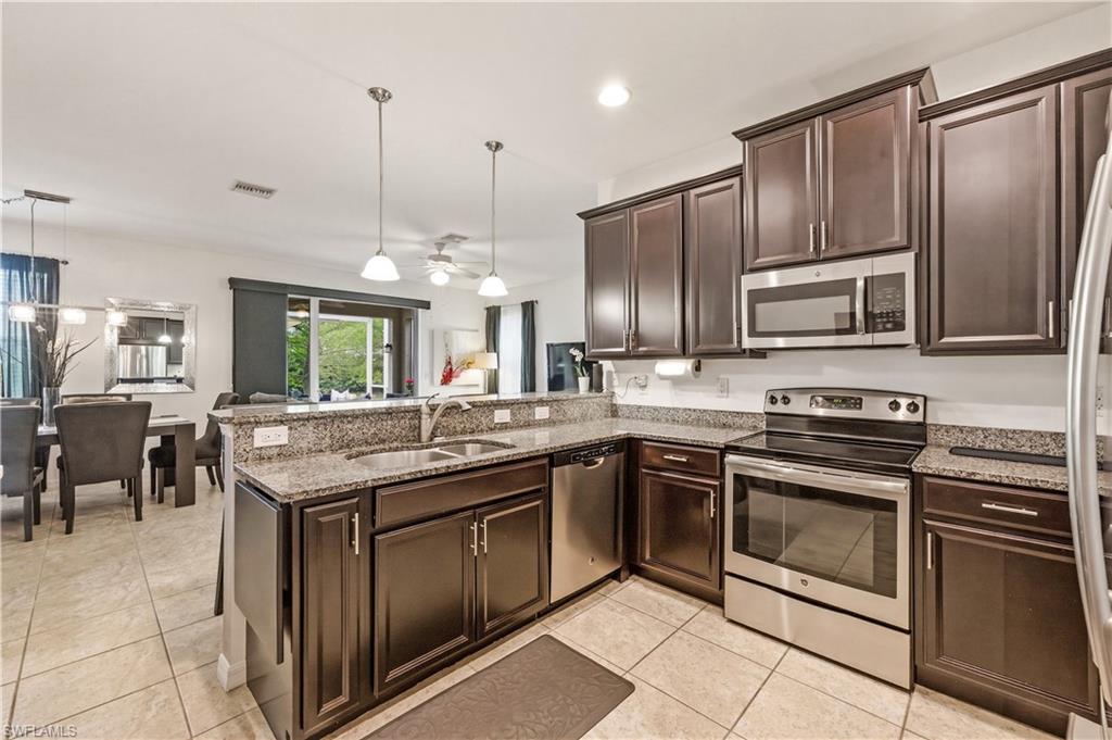 19540 Bowring Park Road, Unit 101 Fort Myers, FL 33967 - Photo 15 of 46 Kitchen with stainless steel appliances (refrigerator, oven, microwave and dishwasher)