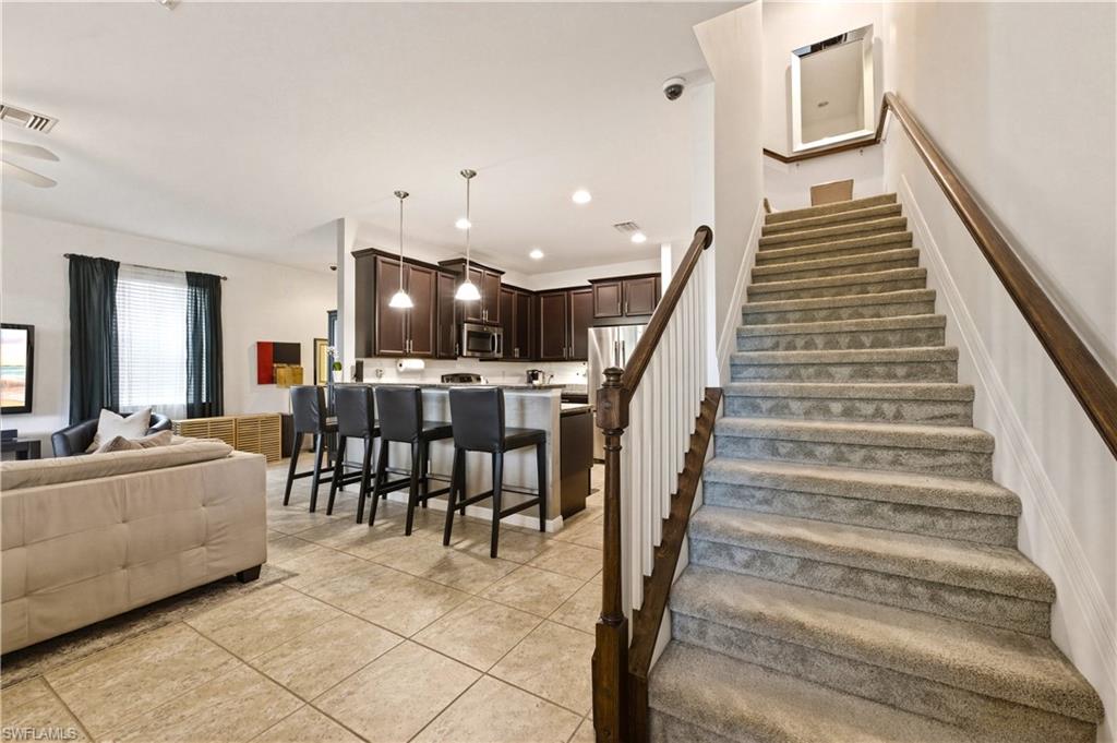 19540 Bowring Park Road, Unit 101 Fort Myers, FL 33967 - Photo 20 of 46 Stairway to bedrooms, loft, full bathrooms and laundry (washer & dryer)
