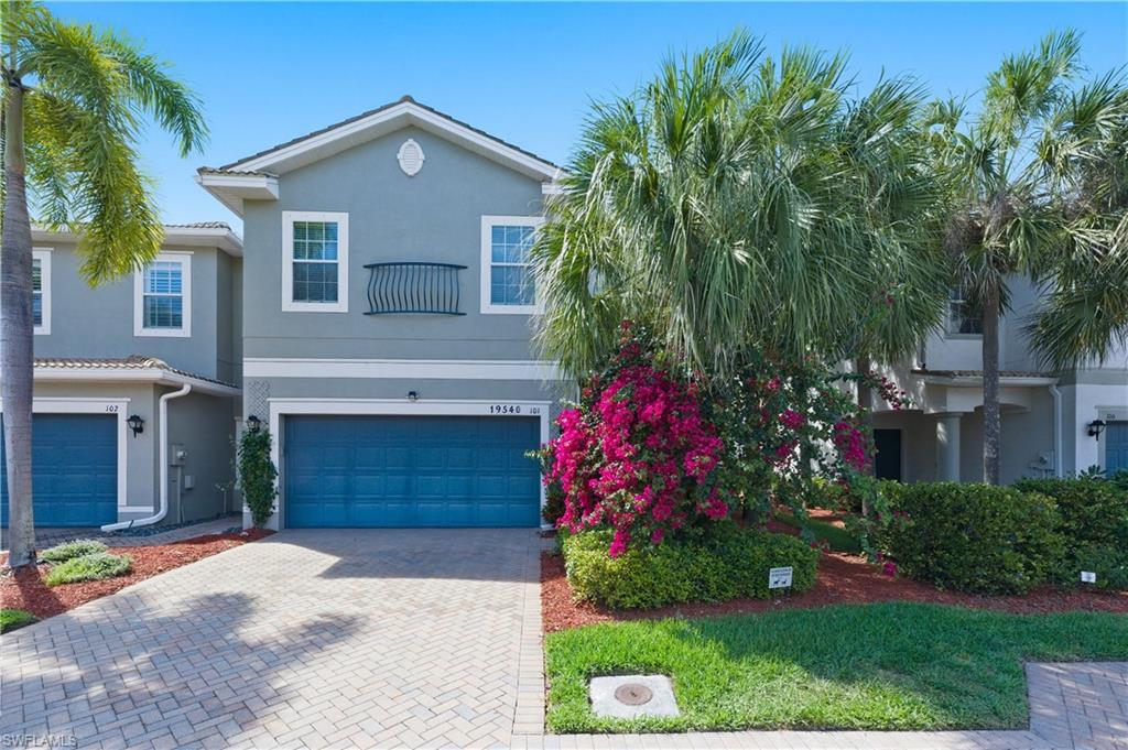 19540 Bowring Park Road, Unit 101 Fort Myers, FL 33967 - Photo 2 of 46 View of front of home; two car garage; two car parking on driveway