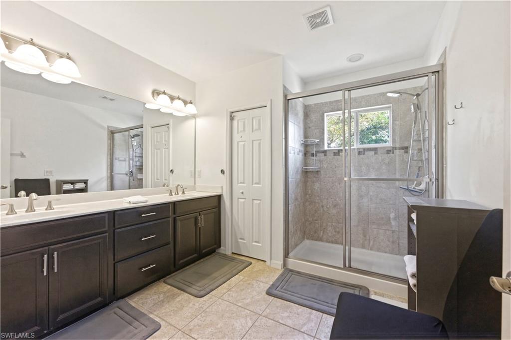 19540 Bowring Park Road, Unit 101 Fort Myers, FL 33967 - Photo 26 of 46 Full bath featuring double vanity and a walking shower