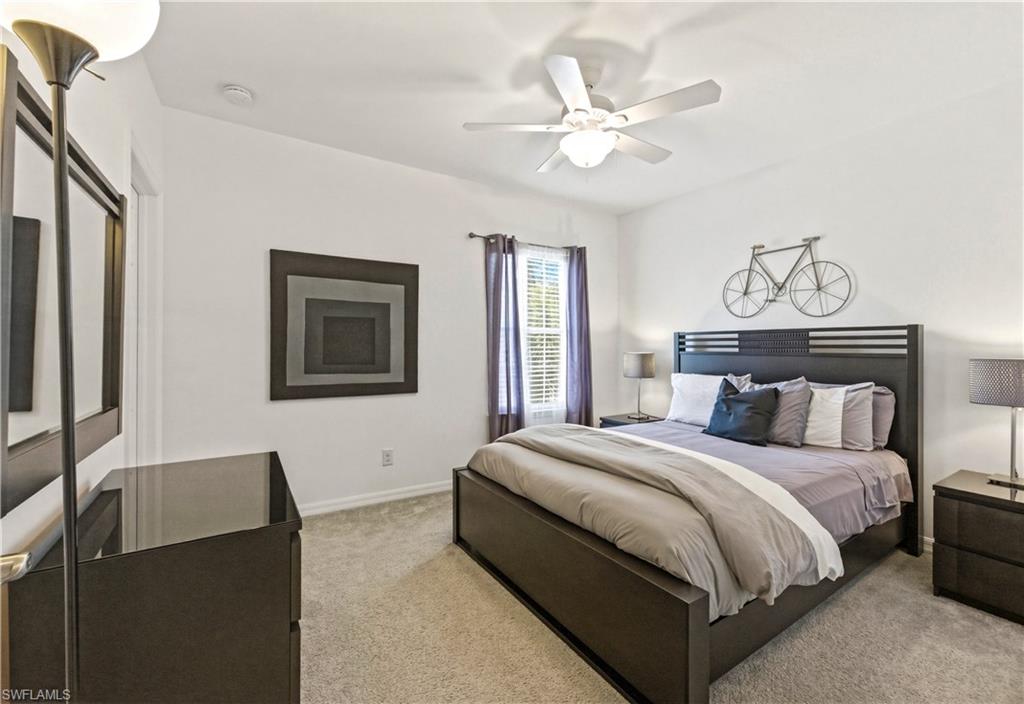 19540 Bowring Park Road, Unit 101 Fort Myers, FL 33967 - Photo 27 of 46 Guest bedroom with queen size bed, dresser and nightstands