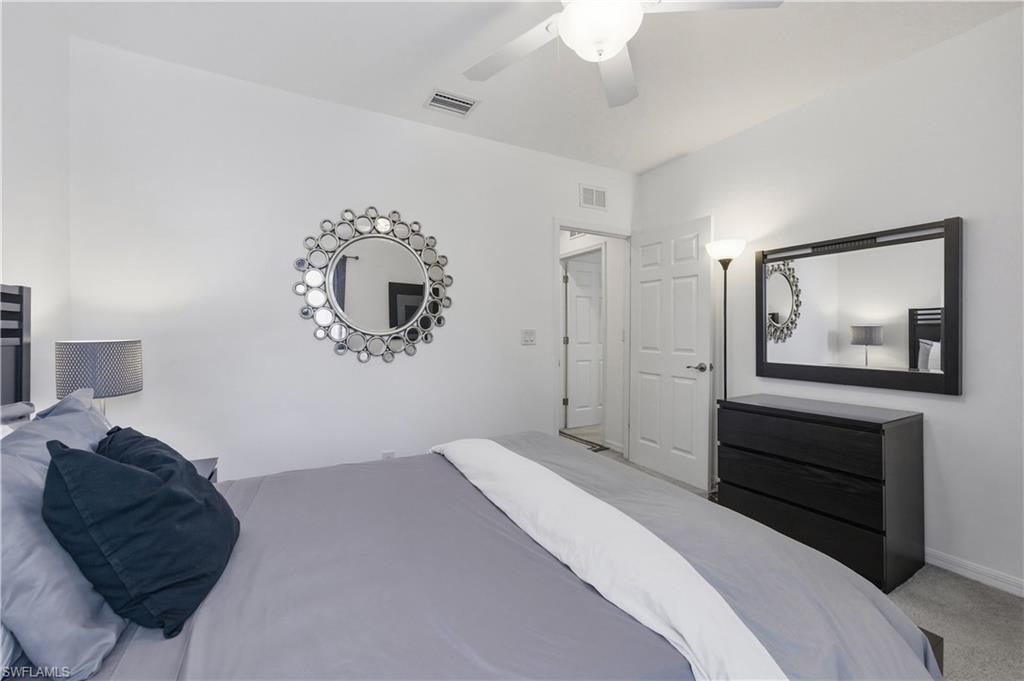 19540 Bowring Park Road, Unit 101 Fort Myers, FL 33967 - Photo 28 of 46 Guest bedroom with queen size bed, dresser and nightstands