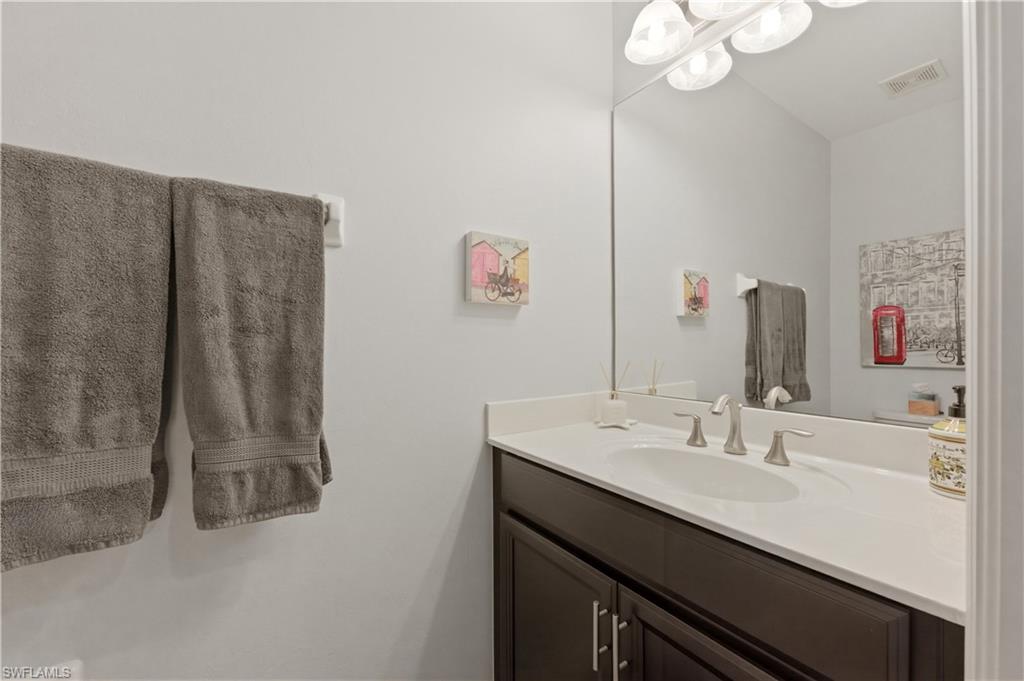 19540 Bowring Park Road, Unit 101 Fort Myers, FL 33967 - Photo 6 of 46 Half bathroom in entry hallway