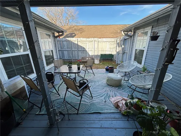 a view of a chairs and table in the patio