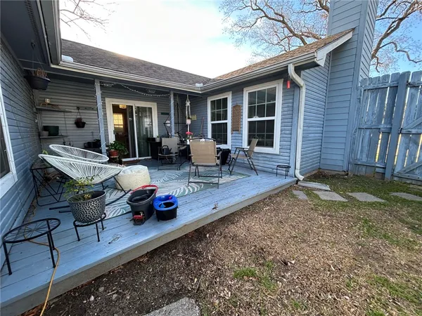 a view of house with backyard outdoor seating area and furniture