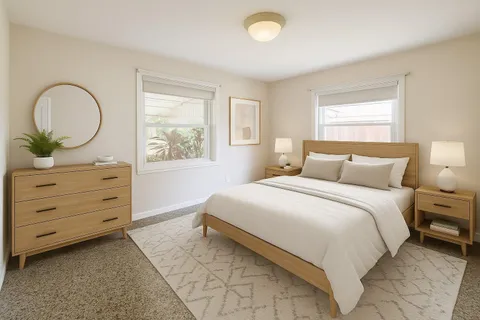 a bedroom with a bed and a dresser