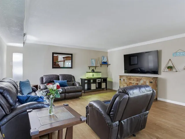a kitchen with stainless steel appliances granite countertop a sink and a stove