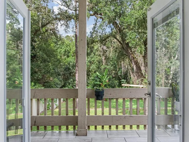 a spacious bathroom with a granite countertop sink mirror and shower