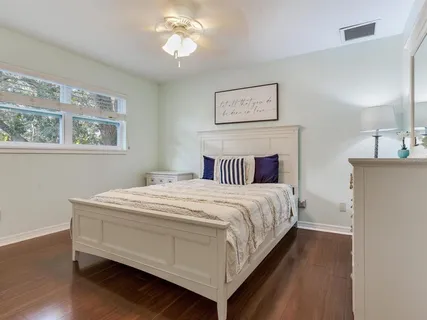 a bedroom with a bed and a cabinets