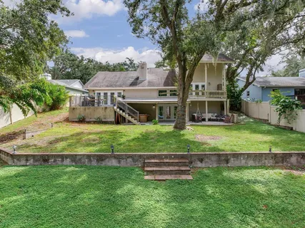 a view of a park with large trees