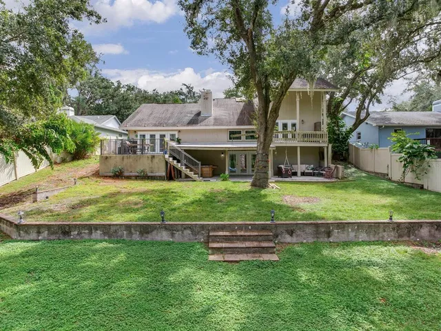 a view of a park with large trees