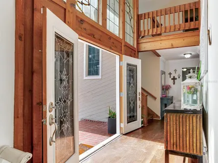 a view of a balcony with wooden floor and stairs