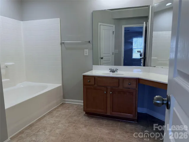 a bathroom with a sink and a bathtub