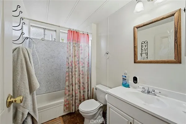 a bed room with a bed and a dresser