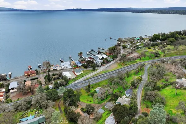 an aerial view of a house with garden space and street view