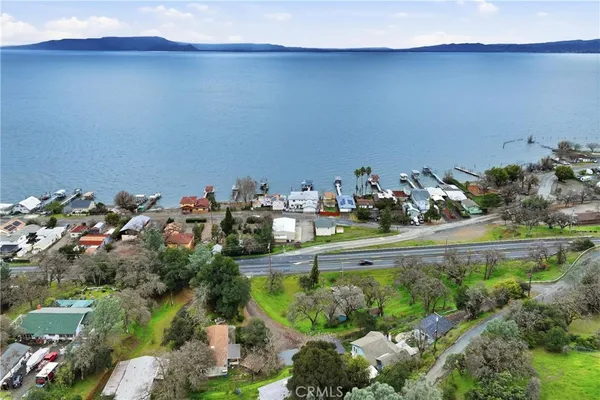 an aerial view of a house with garden space and street view