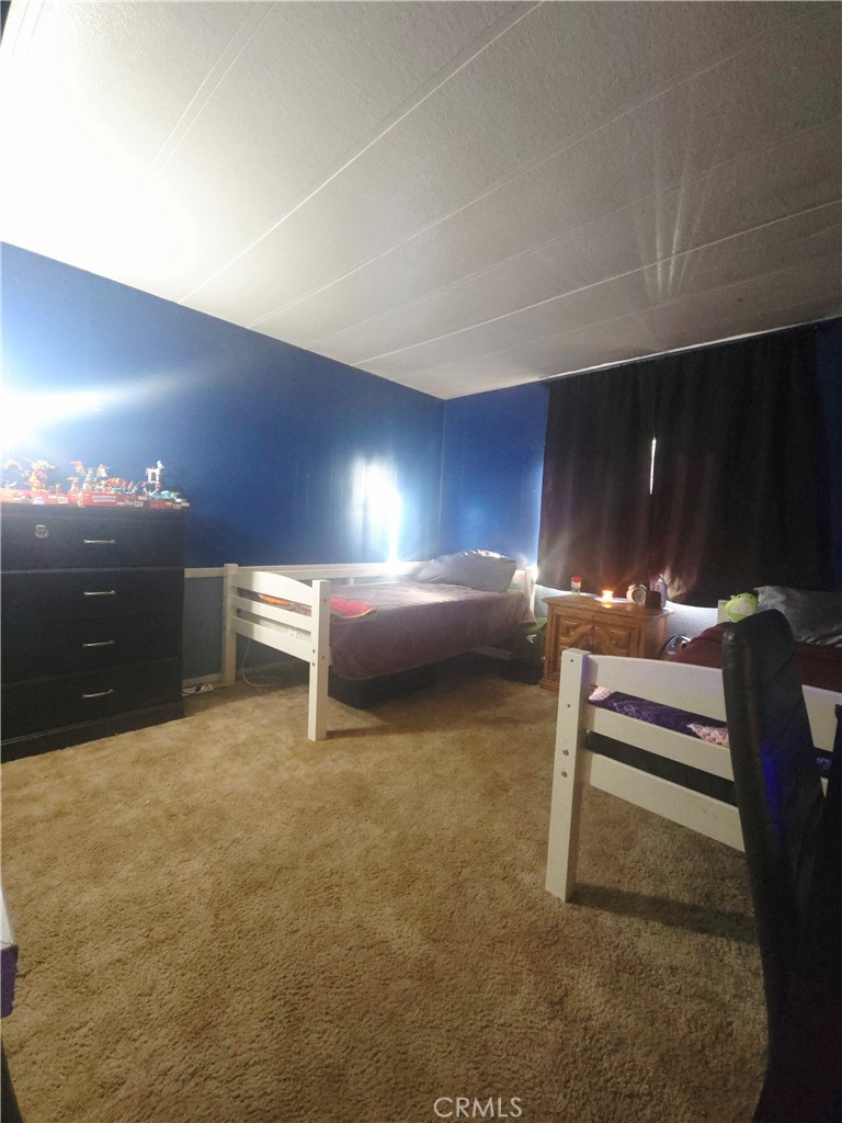 3114 Manzanita Road Nice, CA 95464 - Photo 4 of 10 a bedroom with furniture and lamp