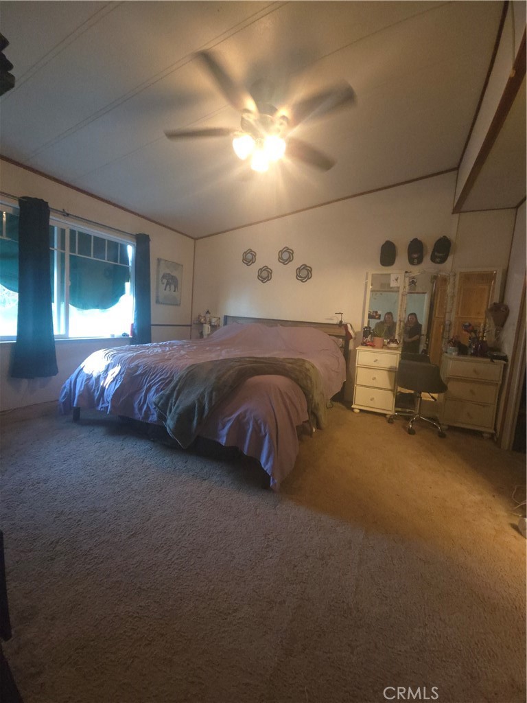 3114 Manzanita Road Nice, CA 95464 - Photo 7 of 10 a bed room with a bed and a night stand