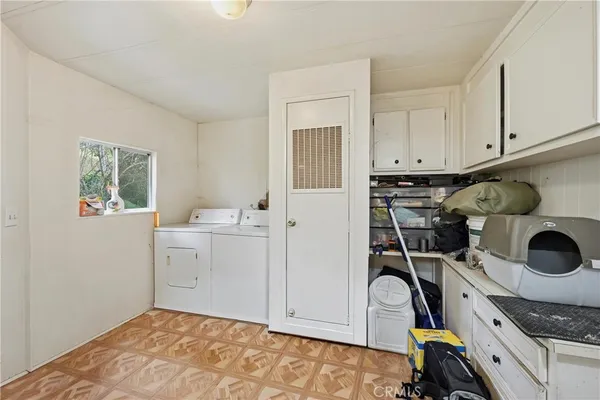 a bed room with a bed and a chandelier