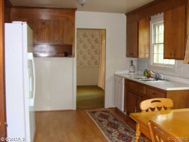 1323 Covington Road Colonial Heights, VA 23834 - Photo 4 of 12 a bedroom with a bed and a cabinets