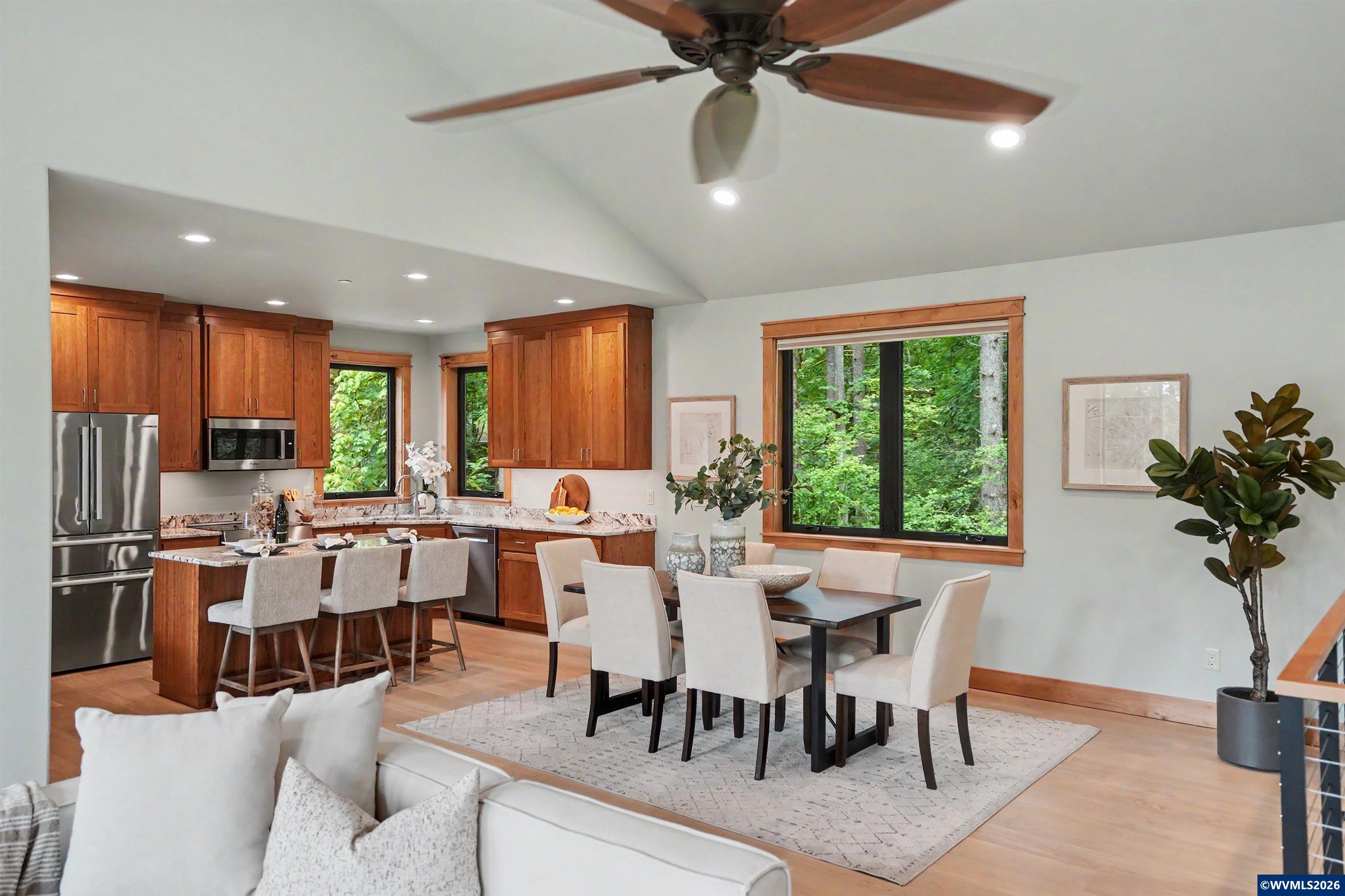 1155 Northwest Country Hills Road Corvallis, OR 97330 - Photo 39 of 48 a view of a dining room and livingroom with furniture window and wooden floor