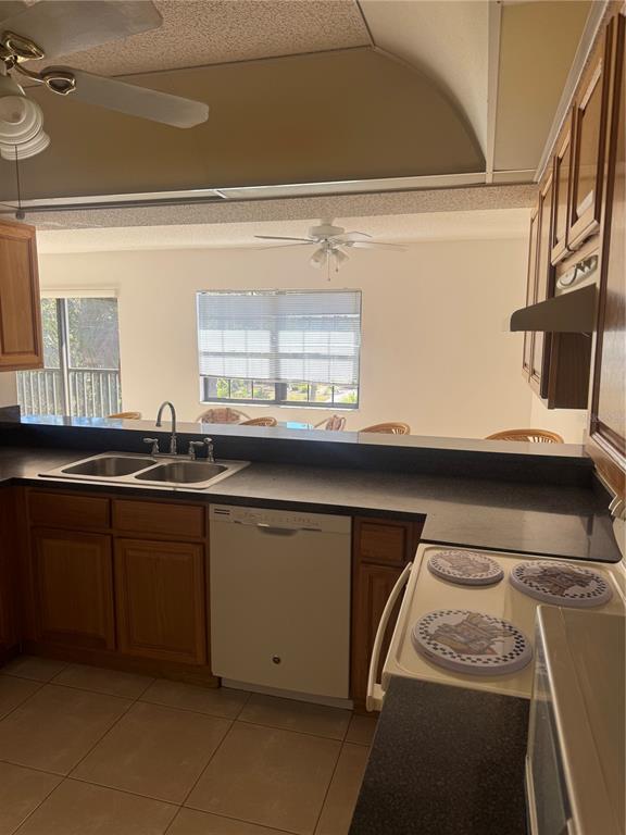 23465 Harbor View Road, Unit 201 Punta Gorda, FL 33980 - Photo 11 of 50 a kitchen with a sink and cabinets
