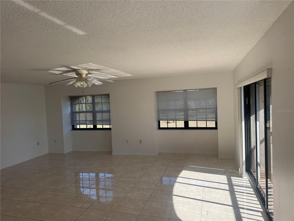 23465 Harbor View Road, Unit 201 Punta Gorda, FL 33980 - Photo 22 of 50 a view of an empty room with a window