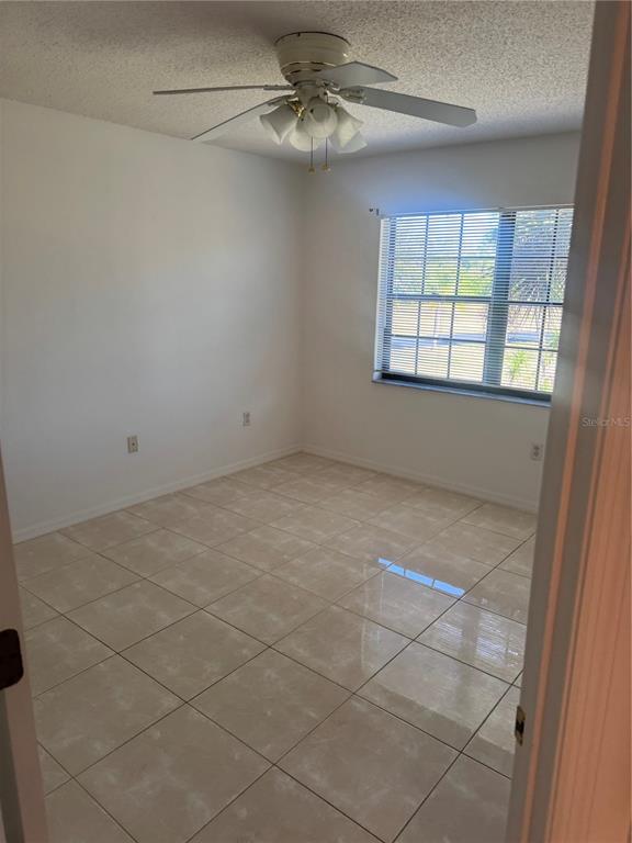 23465 Harbor View Road, Unit 201 Punta Gorda, FL 33980 - Photo 24 of 50 a view of an empty room with a window