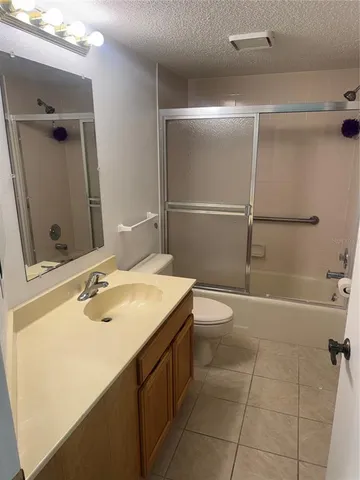 a bathroom with a sink toilet tub and shower