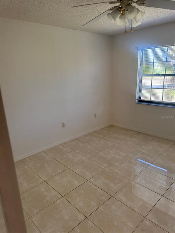 23465 Harbor View Road, Unit 201 Punta Gorda, FL 33980 - Photo 27 of 50 an empty room with a window