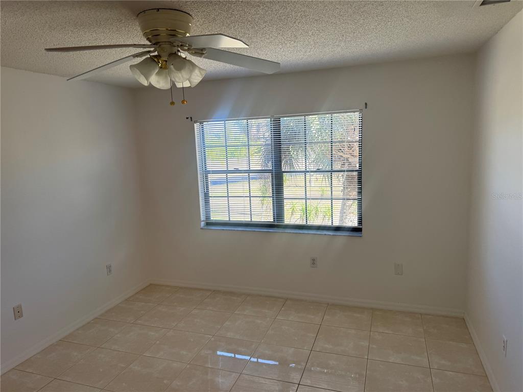 23465 Harbor View Road, Unit 201 Punta Gorda, FL 33980 - Photo 28 of 50 an empty room with a window