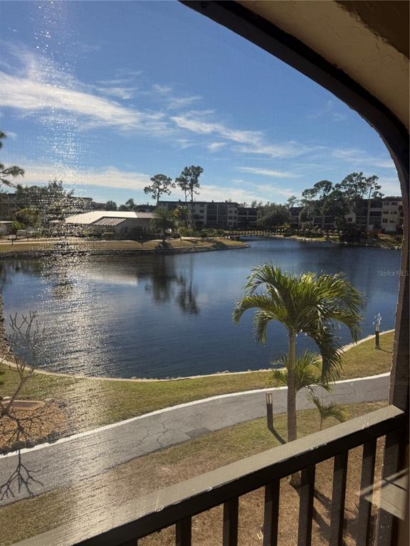 23465 Harbor View Road, Unit 201 Punta Gorda, FL 33980 - Photo 32 of 50 a view of a lake from a balcony